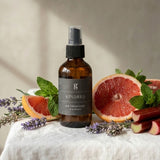 Graced Kindred air freshener for home fragrance, compact spray bottle with elegant design for freshening indoor spaces.
