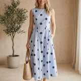 Klesis sleeveless polka dot midi dress on virtual model, featuring a classic polka dot pattern and a stylish midi length.
