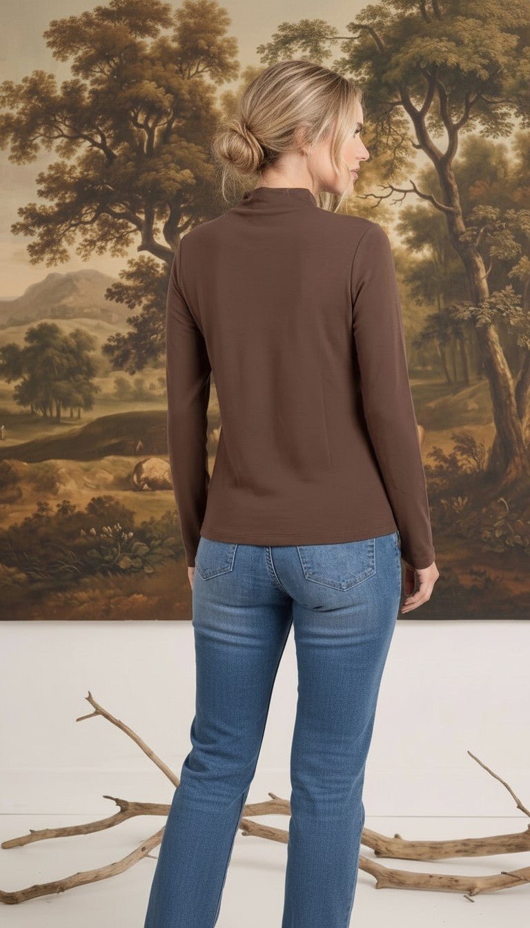 graced mocha brown long sleeve mock neck knit top worn by a woman with blonde hair in a bun, back view