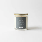 Graced Lake Life soy wax candle in a jar, showcasing a calming ocean-inspired label and natural candle wax inside.
