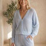 Small Mono B Coastal Crochet Knit Top in halogen blue, showcasing a stylish, lightweight crochet design perfect for casual wear.