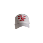 White cap with 'Party in the USA' text in red on a white background