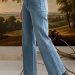 graced wide leg denim jeans with patch pockets worn by a model in a white shirt and black boots