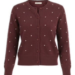 graced burgundy cardigan with raised white polka dots, featuring a button-up front and ribbed cuffs in a wool blend.