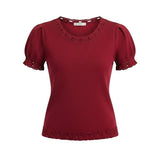 Red knit puff sleeve top with scallop trim by Camellia, featuring a stylish and feminine design.