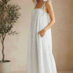 Striped Lovestitch shirred tie-shoulder maxi dress with flowing silhouette and adjustable straps, perfect for warm weather.