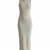 Olive and off-white sleeveless boat neck midi dress by Active Basic, showcasing a fitted silhouette and elegant design.