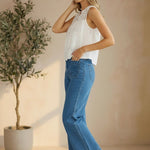 White sleeveless eyelet lace tank top by Lovestitch with delicate eyelet detailing and a relaxed fit.