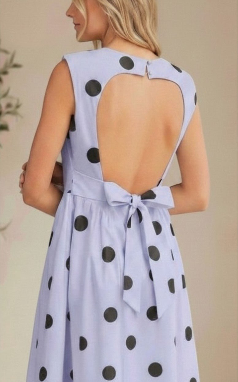 Klesis sleeveless polka dot midi dress with a fitted bodice and flowing skirt, perfect for summer occasions.