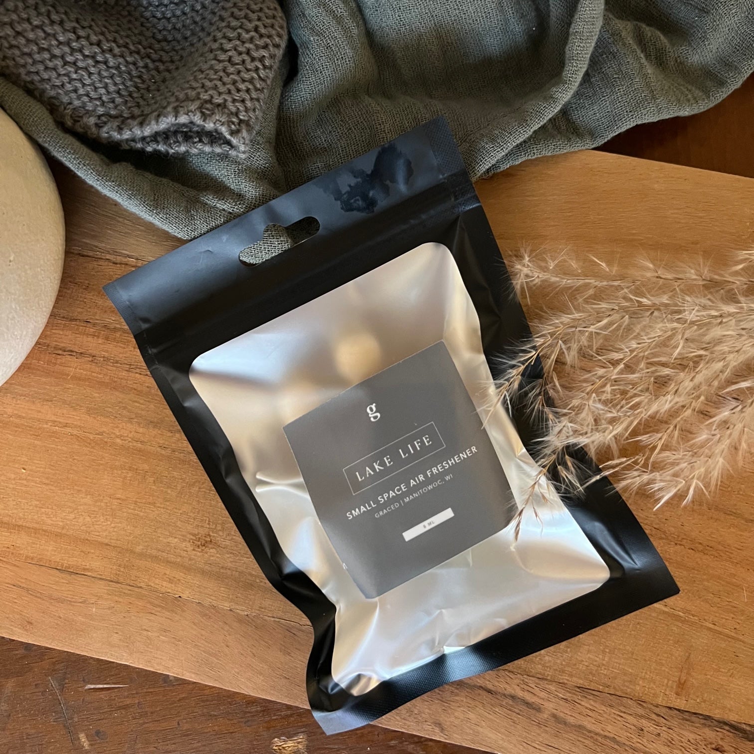 Graced Lake Life small space air freshener with fresh, airy fragrance for home use, featuring a sleek design.