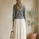 Off-white Be Cool smocked waist midi skirt, stylish bottoms with a relaxed fit and gathered waistband, perfect for casual wear.