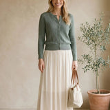 Be Cool off-white smocked waist midi skirt, stylish bottoms with a flowy silhouette and comfortable fit.