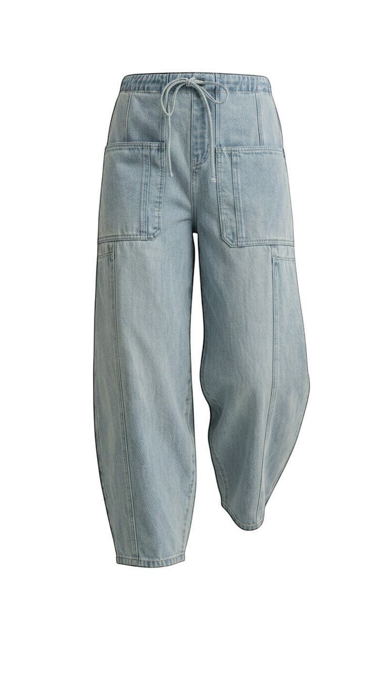 graced light wash denim barrel pants with a relaxed fit, elastic drawstring waist, and large front patch pockets.