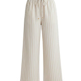 Allie Rose striped smock waist pants featuring a relaxed fit, lightweight fabric, and bold vertical stripes for a stylish look.