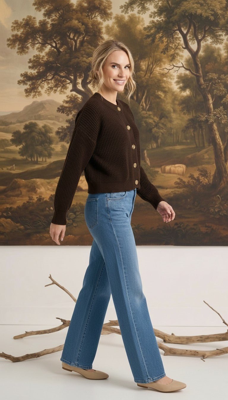 graced textured dark brown button down cardigan worn by a woman with blue jeans and beige flats