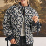 graced Alexis floral quilted cotton jacket with navy blue bow sleeve details worn by a model