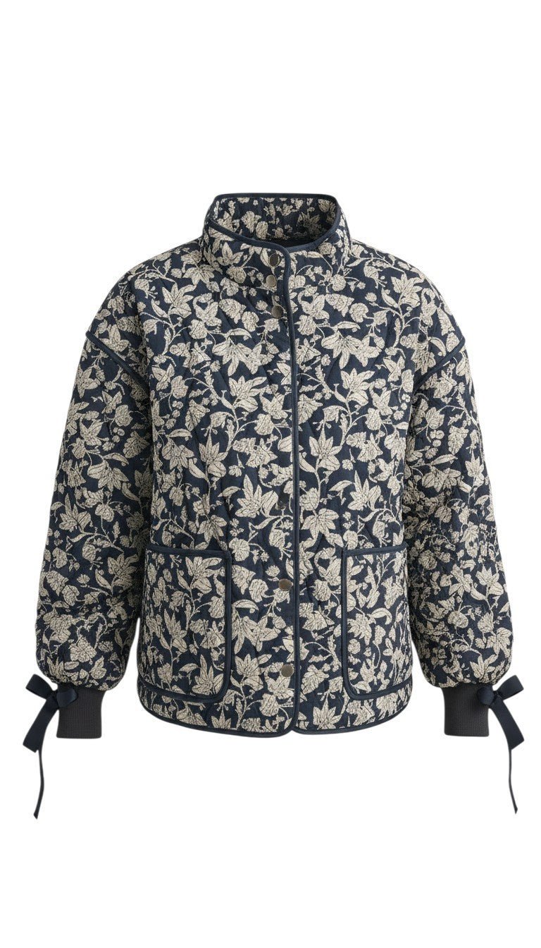 graced Alexis floral quilted jacket in navy and cream cotton with bow details on the sleeve cuffs
