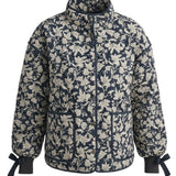 graced Alexis floral quilted jacket in navy and cream cotton with bow details on the sleeve cuffs