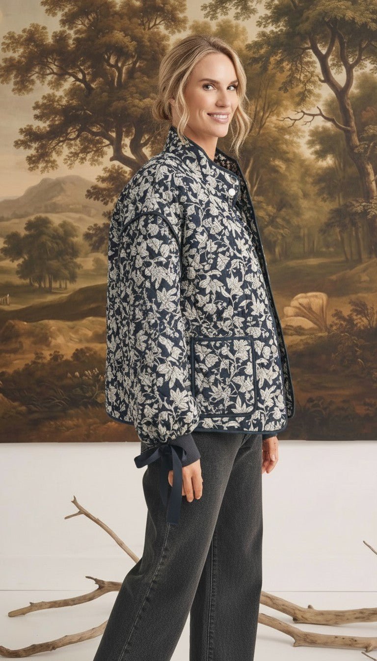 graced Alexis floral quilted cotton jacket with sleeve bow details worn by a model in a studio setting