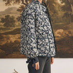 graced Alexis floral quilted cotton jacket with sleeve bow details worn by a model in a studio setting