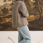 graced The Alyssa animal print jacket with a brown corduroy collar worn by a woman in light blue jeans