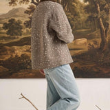 graced The Alyssa animal print jacket with a brown corduroy collar worn by a woman in light blue jeans