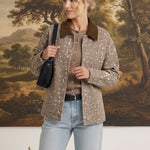 graced Alyssa jacket in beige animal print with a brown corduroy collar worn by a model with light blue jeans