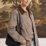 Model wearing graced The Alyssa Animal Print Jacket with a brown corduroy collar and black shoulder bag