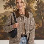 graced The Alyssa Animal Print Jacket in beige with a brown corduroy collar worn by a woman with a black shoulder bag