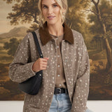 graced The Alyssa Animal Print Jacket in beige with a brown corduroy collar worn by a woman with a black shoulder bag