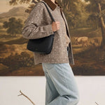 graced Alyssa animal print cotton jacket with a brown corduroy collar worn by a woman with a black shoulder bag