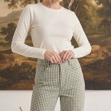 Model wearing graced Alyssa Gingham Barrel Pants in green and white cotton blend with a relaxed silhouette