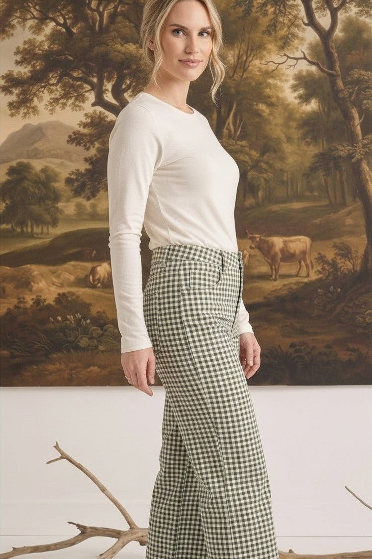 Model wearing graced Alyssa Gingham Barrel Pants in green and white cotton blend with a relaxed silhouette