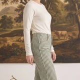 Model wearing graced Alyssa Gingham Barrel Pants in green and white cotton blend with a relaxed silhouette