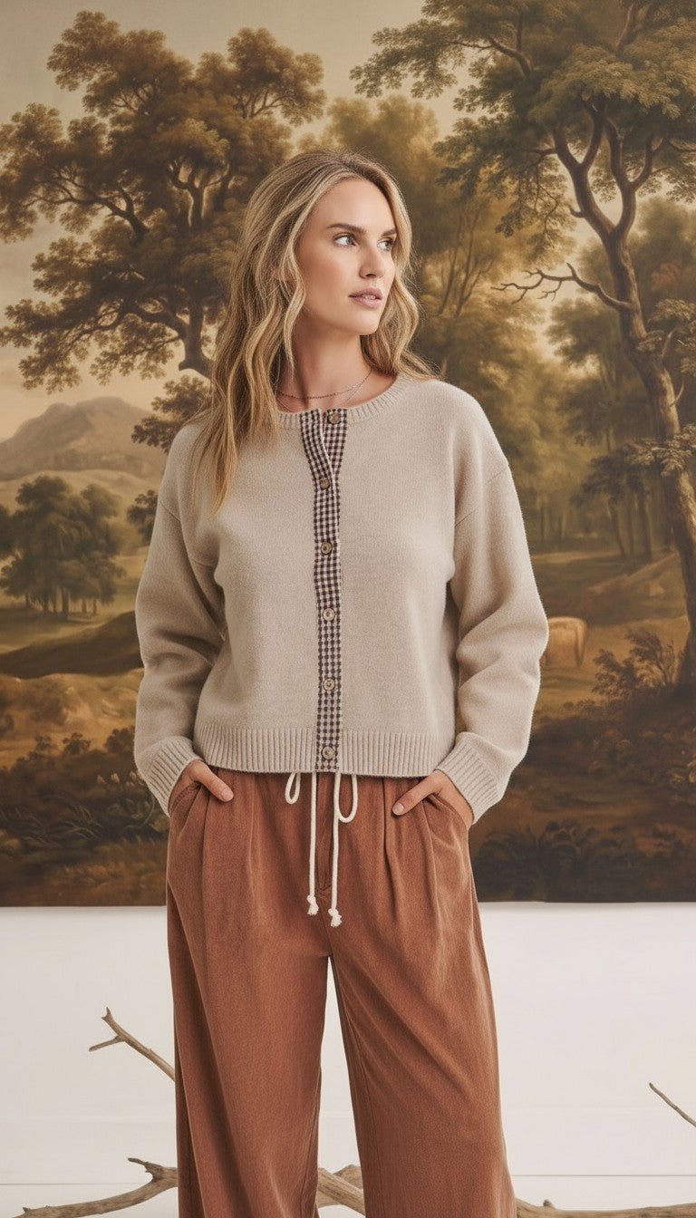 graced Baylie cardigan in beige with brown gingham trim along the button placket worn by a model
