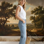 graced Blaine high rise straight leg jeans in light blue denim worn by a woman with a white sleeveless top