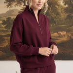 graced dark cherry ribbed quarter-zip sweater worn by a model in a relaxed fit with a high collar