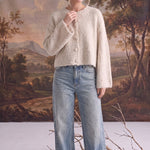 graced Callie fuzzy knit cardigan in cream with a round neckline and drop shoulders worn with light wash jeans
