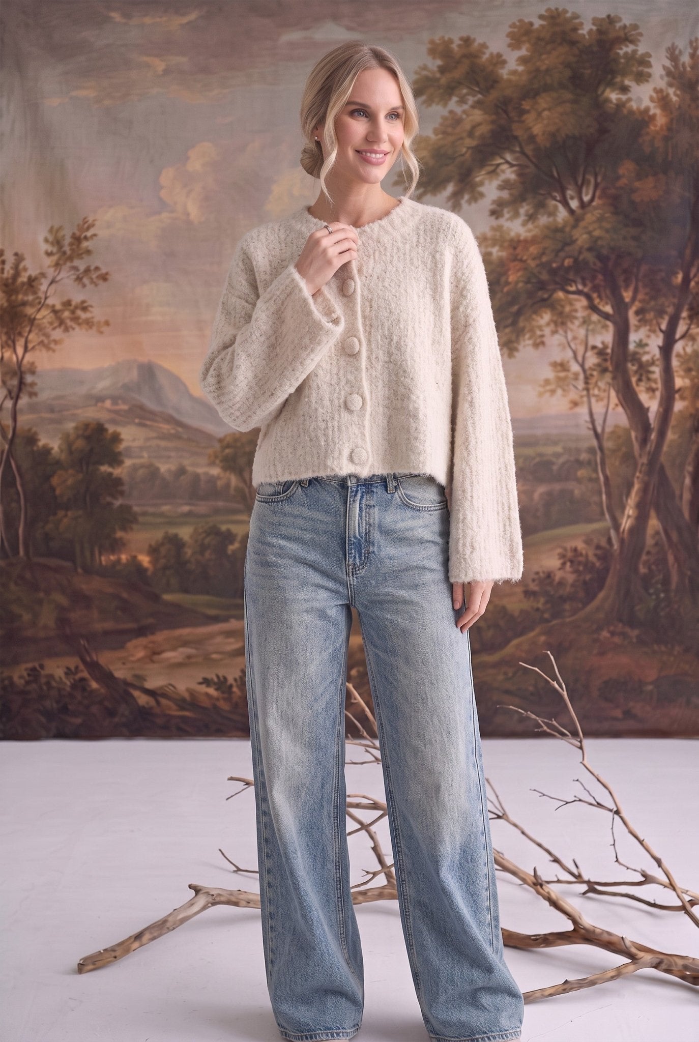 graced Callie fuzzy knit cardigan in cream with a round neckline and drop shoulders worn with light wash jeans