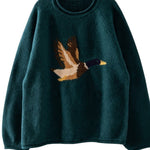 graced Carley Mallard sweater in forest green featuring a flying duck knit design and cozy crew neck fit