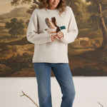 graced Carley Mallard sweater in oatmeal featuring a mallard duck intarsia design, worn with blue jeans and loafers