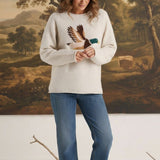 graced Carley Mallard sweater in oatmeal featuring a mallard duck intarsia design, worn with blue jeans and loafers