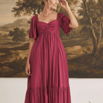 graced Celeste midi dress in deep burgundy with puff sleeves and a sweetheart neckline worn by a model