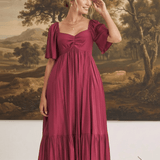 graced Celeste midi dress in deep burgundy with puff sleeves and a sweetheart neckline worn by a model