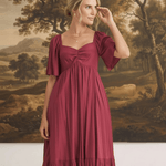 graced Celeste midi dress in deep red with puff sleeves and a sweetheart neckline worn by a model