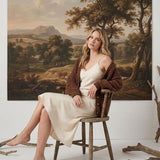 graced Chloe chunky knit cardigan in mocha worn by a blonde model over a cream slip dress in a rustic setting