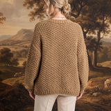 graced Chloe chunky knit cardigan in olive worn by a model, back view showing textured acrylic fabric and relaxed fit