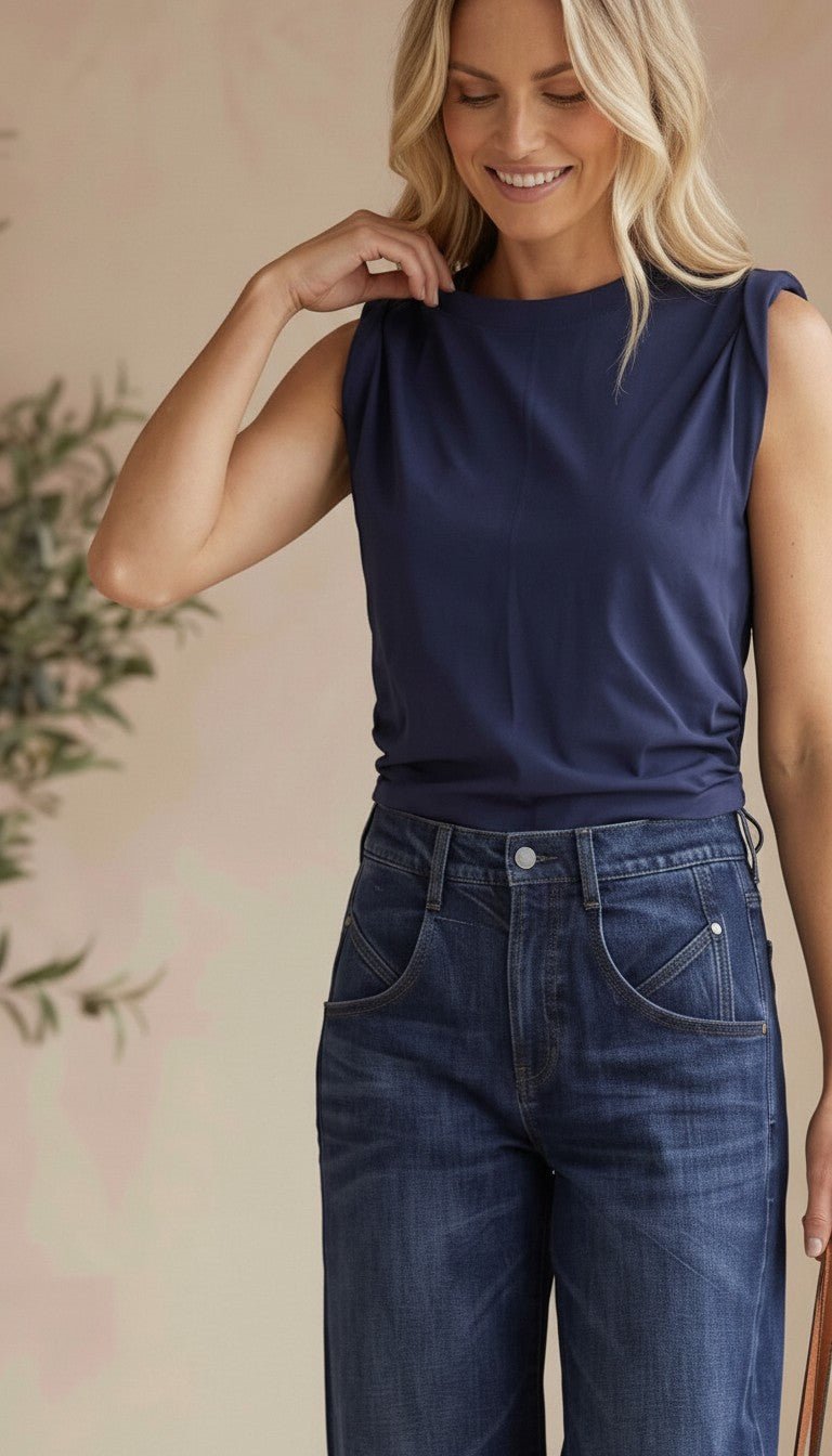 graced The Cinch Side Top in new navy cotton with a flattering side tie detail worn by a smiling blonde model