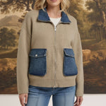 graced The Dolly zip-up sweater jacket in taupe with contrasting blue denim collar and pocket details on a model.