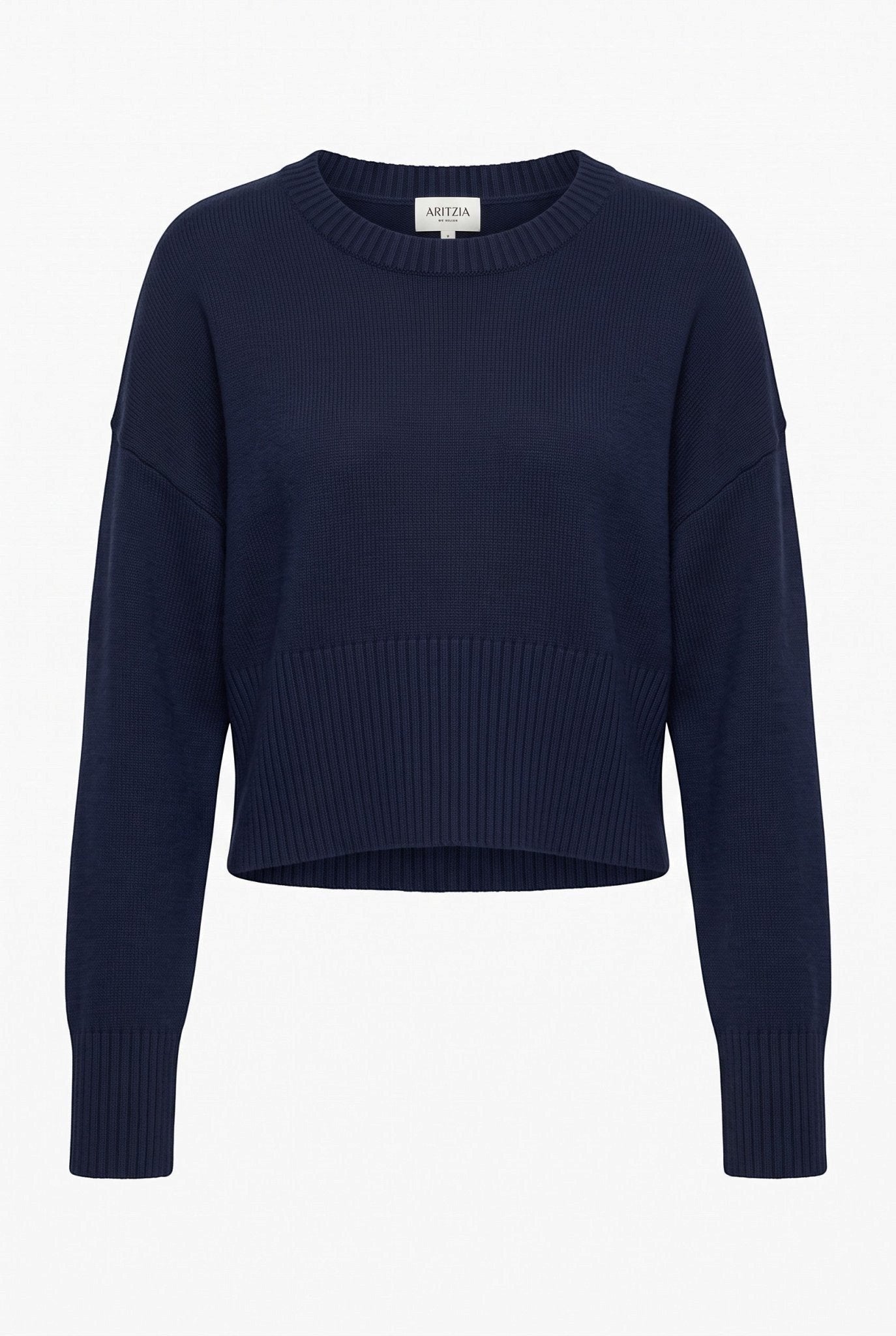 graced Eloise navy crew neck sweater with dropped shoulders, wide ribbed cuffs, and a cropped hem in a soft knit.
